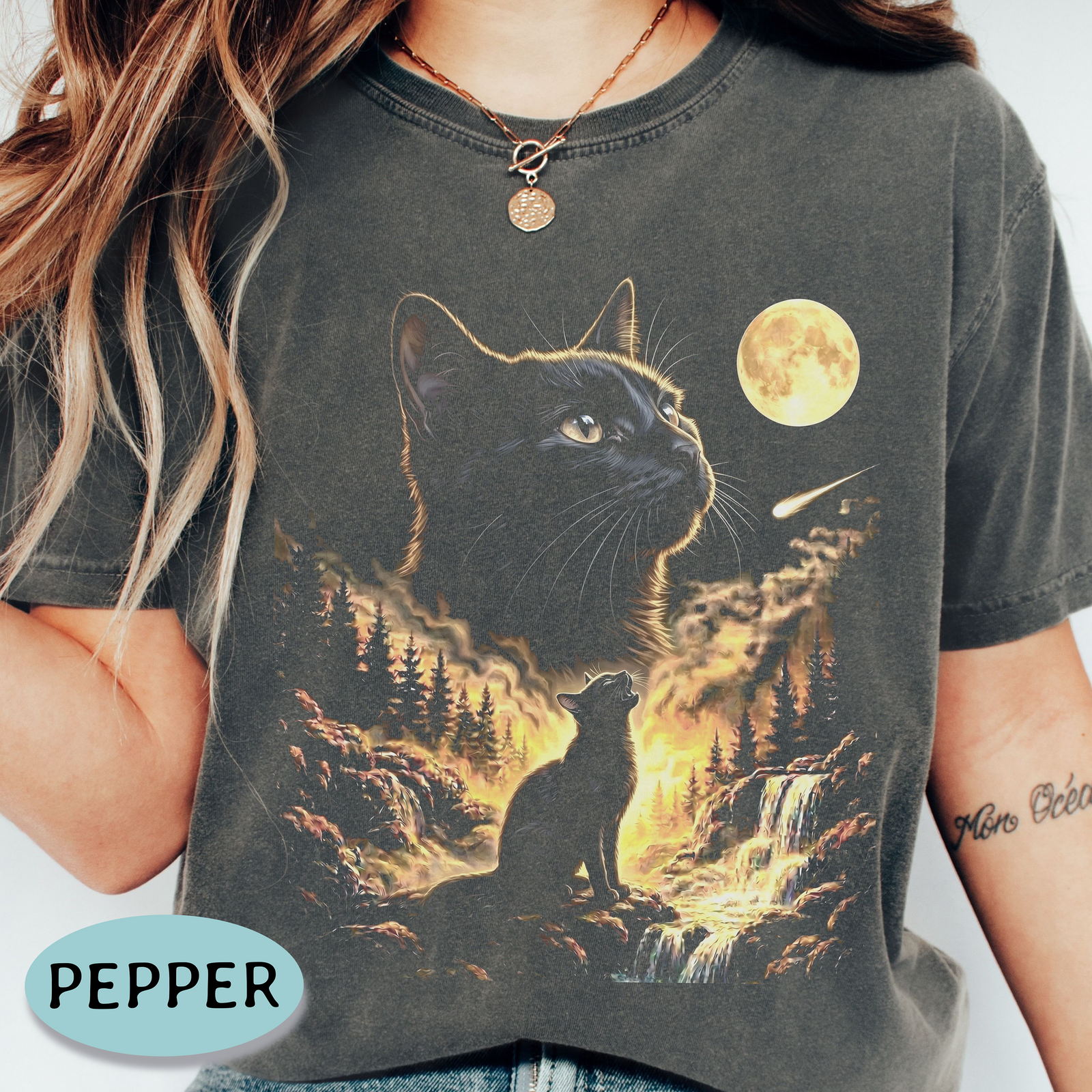 Black cat howling at the full moon in a golden forest on a Pepper Comfort Colors graphic shirt